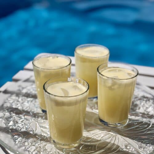 creamy orange cocktails by the pool